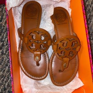 Cleaning closet getting rid of Tory Burch sandals